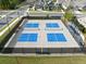 Aerial view of four well-maintained community pickleball courts in a residential neighborhood at 209 Floral Valley Dr, Woodstock, GA 30188