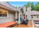 Cozy back deck with a hot tub, outdoor dining, and serene outdoor space for entertaining at 324 Kibbee Rd, Mcdonough, GA 30252