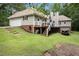 View of backyard with deck and house at 324 Kibbee Rd, Mcdonough, GA 30252