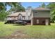 Expansive backyard and partial view of deck and house at 324 Kibbee Rd, Mcdonough, GA 30252