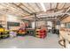 Unfinished basement with ample storage, a workbench, and organizational shelving at 324 Kibbee Rd, Mcdonough, GA 30252