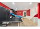 Finished basement with a ping pong table and basketball hoop for Gathering fun at 324 Kibbee Rd, Mcdonough, GA 30252