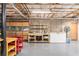 Unfinished basement offering a workbench, storage, and a convenient garage door access at 324 Kibbee Rd, Mcdonough, GA 30252