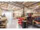 Open basement area featuring storage and workbench; leads to living area at 324 Kibbee Rd, Mcdonough, GA 30252