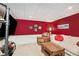 Finished basement featuring a comfortable seating area and large-screen TV at 324 Kibbee Rd, Mcdonough, GA 30252