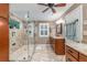 Modern bathroom featuring a glass-enclosed shower and a vanity with granite countertop at 324 Kibbee Rd, Mcdonough, GA 30252