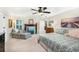 Comfortable bedroom featuring a ceiling fan, sitting area, and unique decor at 324 Kibbee Rd, Mcdonough, GA 30252