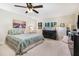 Comfortable bedroom featuring a ceiling fan and bright natural light at 324 Kibbee Rd, Mcdonough, GA 30252