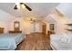 Large bonus room with wood floors, a ceiling fan, and plenty of space at 324 Kibbee Rd, Mcdonough, GA 30252