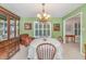 Bright dining room with traditional furniture set, chandelier, and a large window at 324 Kibbee Rd, Mcdonough, GA 30252