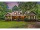 Charming ranch-style home features a welcoming front porch and well-maintained landscaping at 324 Kibbee Rd, Mcdonough, GA 30252