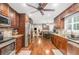 Spacious kitchen features stainless steel appliances, granite counters, tile backsplash, and wood cabinets at 324 Kibbee Rd, Mcdonough, GA 30252