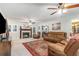 Spacious living room with a cozy fireplace, comfortable seating, and plenty of natural light at 324 Kibbee Rd, Mcdonough, GA 30252