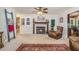 Cozy living room with a fireplace, leather chair, and view into breakfast nook at 324 Kibbee Rd, Mcdonough, GA 30252
