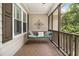 Relaxing screened porch features a swing, stylish decor, and a cozy atmosphere with outdoor views at 324 Kibbee Rd, Mcdonough, GA 30252