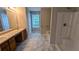 Bathroom features a double sink vanity and a shower with tub at 4373 Abram Dr, Conley, GA 30288