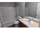 Clean bathroom featuring a shower-tub combo and a vanity with ample storage at 4373 Abram Dr, Conley, GA 30288