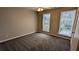 Bedroom with a ceiling fan and windows overlooking the backyard at 4373 Abram Dr, Conley, GA 30288
