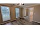 Cozy bedroom offering two large windows, laminate floors, and neutral paint at 4373 Abram Dr, Conley, GA 30288