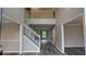 Bright foyer with hardwood flooring, staircase, and open view to the second floor at 4373 Abram Dr, Conley, GA 30288
