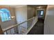 Bright and airy hallway with natural light, carpeted floors, and a staircase leading to the lower level at 4373 Abram Dr, Conley, GA 30288