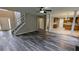 Spacious living area with high ceilings, staircase, and view into the kitchen at 4373 Abram Dr, Conley, GA 30288