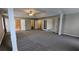 Large main bedroom featuring vaulted ceiling, neutral paint, plush carpet and many doors at 4373 Abram Dr, Conley, GA 30288