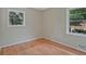 Cozy bedroom featuring a double window, hardwood floors, and neutral paint at 622 Sheffield Rd, Norcross, GA 30071
