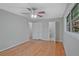 Bedroom featuring hardwood floors, neutral paint, ceiling fan, and closet at 622 Sheffield Rd, Norcross, GA 30071