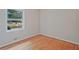 Cozy bedroom featuring hardwood floors and a window offering views of the outdoors at 622 Sheffield Rd, Norcross, GA 30071