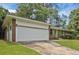 Lovely single-story brick home with green shutters and a front-facing two-car garage at 622 Sheffield Rd, Norcross, GA 30071