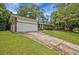 Charming single-story brick home with a well manicured front yard and front facing garage at 622 Sheffield Rd, Norcross, GA 30071