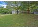 Charming brick home with a well-manicured front yard and mature trees providing ample shade at 622 Sheffield Rd, Norcross, GA 30071