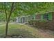 Charming single-story brick home with green shutters and front-facing garage at 622 Sheffield Rd, Norcross, GA 30071