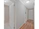 Bright hallway featuring hardwood floors and multiple doorways, providing easy access to various rooms at 622 Sheffield Rd, Norcross, GA 30071