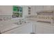 Updated kitchen with stainless steel sink, granite countertops, and ample cabinet space for storage at 622 Sheffield Rd, Norcross, GA 30071