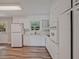 Bright kitchen with white cabinets, modern appliances, and a window offering a view to the outdoors at 622 Sheffield Rd, Norcross, GA 30071