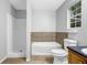 Bathroom featuring a shower-tub combination and a vanity sink with dark countertop at 10073 Dorothy Ct, Jonesboro, GA 30236