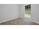 Bright bedroom with large window providing natural light, and tile flooring at 10073 Dorothy Ct, Jonesboro, GA 30236