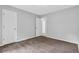 Bedroom with plush carpet and a view through the doorway to another room at 10073 Dorothy Ct, Jonesboro, GA 30236