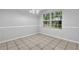 Cozy dining room features a large window offering natural light at 10073 Dorothy Ct, Jonesboro, GA 30236