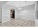 Bright dining room with tile flooring and an elegant chandelier at 10073 Dorothy Ct, Jonesboro, GA 30236