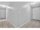 Hallway featuring neutral walls and tile flooring at 10073 Dorothy Ct, Jonesboro, GA 30236