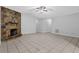Open-concept living room featuring a stone fireplace and tile flooring at 10073 Dorothy Ct, Jonesboro, GA 30236