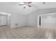 Inviting living room with neutral walls, tile floors, and a ceiling fan at 10073 Dorothy Ct, Jonesboro, GA 30236