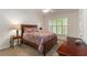 Inviting bedroom featuring a bright window, plush carpets, and a ceiling fan at 2400 Cumberland Se Pkwy # 613, Atlanta, GA 30339