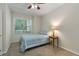 Well-lit bedroom with a ceiling fan, neutral walls, and a peaceful atmosphere at 2400 Cumberland Se Pkwy # 613, Atlanta, GA 30339