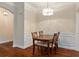 This dining area has hardwood floors, white trim and decorative pendant lighting at 2400 Cumberland Se Pkwy # 613, Atlanta, GA 30339