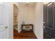 Inviting foyer with dark hardwood flooring, a console table, and an arched entryway to the living spaces at 2400 Cumberland Se Pkwy # 613, Atlanta, GA 30339