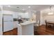 Bright kitchen with white cabinets, an eating bar, and stainless steel appliances, offering a functional design at 2400 Cumberland Se Pkwy # 613, Atlanta, GA 30339